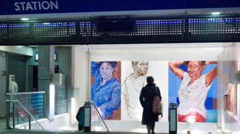Transport for London Claudette Johnson's painting of three black women inside Brixton Tube station, with a passenger in the foreground.