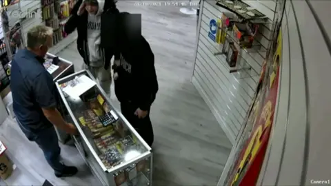 Met CCTV footage of two boys asking for fireworks in a shop