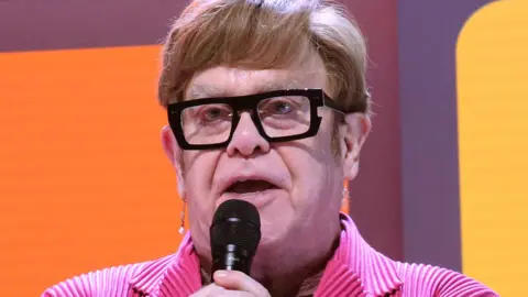 Getty Images Elton John during the opening night curtain call for the new Elton John musical Tammy Faye on Broadway at The Palace Theatre on November 14, 2024 in New York