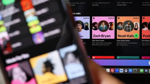 Getty Images Generic image of Spotify dashboard featuring playlists from Zach Bryan and Noah Kahan.
