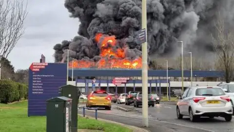 West Lothian Council A fire where flames and huge plumes of smoke can be seen at an industrial estate in West Lothian