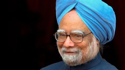 Reuters India's Prime Minister Manmohan Singh, wearing a navy blue suit, light blue turban and a pair of spectacles, smiles before a meeting with Russian President Dmitry Medvedev in New Delhi, India, December 5, 2008.