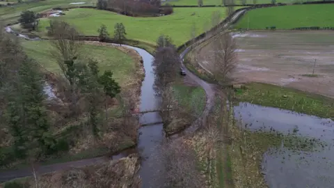 PA Media An aerial of the scene showing a river and ford