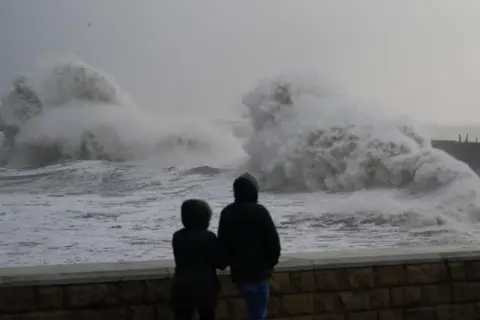 Getty Images Huge waves crash against the seawall in Hartlepool (stock picture)