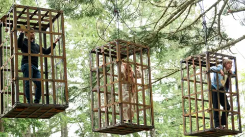 BBC/Studio Lambert Alexander, Fozia and Jack in cages