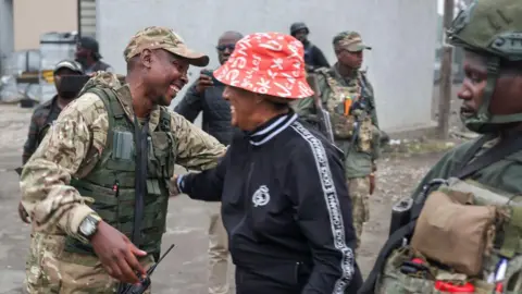 AFP Men in military uniforms who are members M23 armed group on a street in Goma on January 29, 2025.