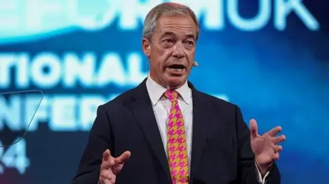Reuters Nigel Farage at Reform UK's conference in Birmingham