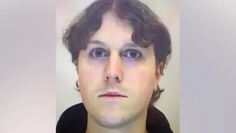 Copyright Unknown A mugshot showing the suspected gunman