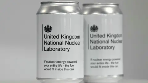 PA Media Two cans reading: "United Kingdom National Nuclear Laboratory" and "If nuclear energy powered your entire life - the fuel would fit inside this can"