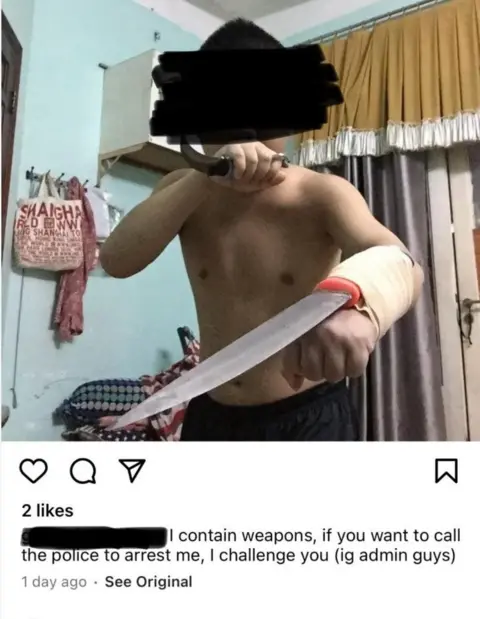 Annie Makeeva A man with a sword bandaged to one arm and a knife in the other