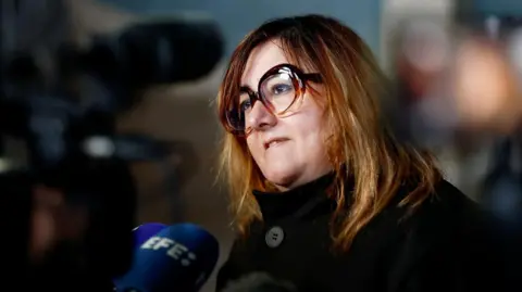 Reuters Francesca Satta, lawyer for some of the alleged victims of Le Scouarnec, speaks to media on Monday