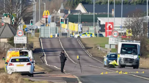 Jasperimage Police carry out investigations on a damaged ambulance