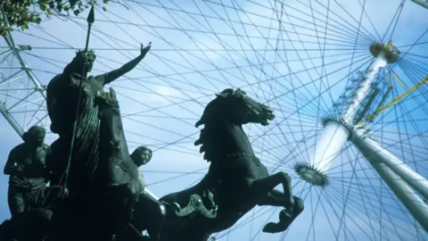 Marks Barfield The statue of Boudicca in front of the wheel at 35 degrees as it was being put into place in London