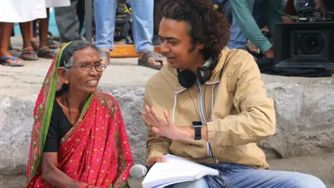 Courtesy: Sthal Writer-director Jayant Digambar Somalkar explains a scene to an elderly female actor on the sets of Marathi film Sthal: A match