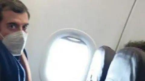 Metropolitan Police handout Roman Dobrokhotov sat next to a window on an aeroplane