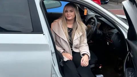 Hannah Robinson Hannah Robinson sitting in her car