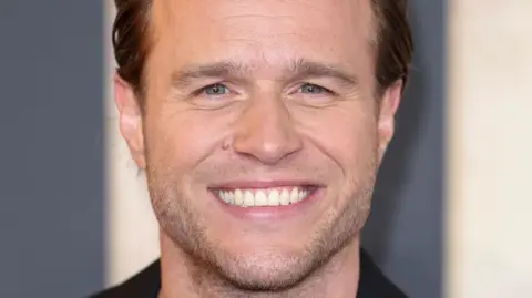 Getty Images Close-up of singer Olly Murs smiling