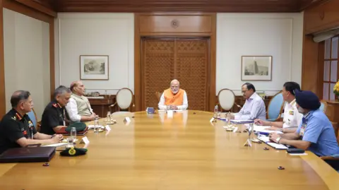 Press Information Bureau, India A handout photo made available by the Press Information Bureau (PIB) shows Indian Prime Minister Narendra Modi (C), Indian Defence Minister Rajnath Singh (3L), National Security advisor Ajit Doval (3R), Chief of Defence Staff Gen. Anil Chauhan (2L), Navy Chief Adm. Dinesh K. Tripathi (2R), Air Force Chief Air Chief Marshal Amar Preet Singh (R) and Army Chief Gen. Upendra Dwivedi (L) during a meeting in New Delhi, India, 29 April 2025.