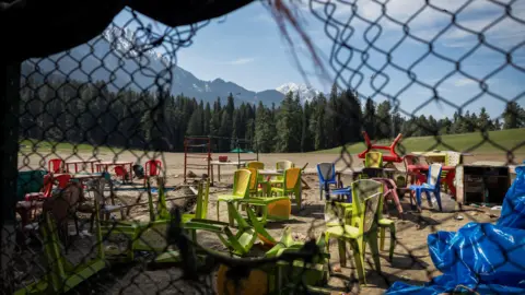 Reuters The photograph shows chairs and tables scattered at the site of a suspected militant attack on tourists in Baisaran near Pahalgam in south Kashmir's Anantnag district, April 24, 2025.