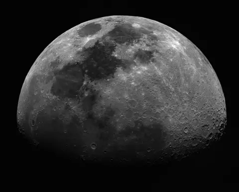 Getty Images An image of the Moon with three quarters illuminated. Against a dark background.