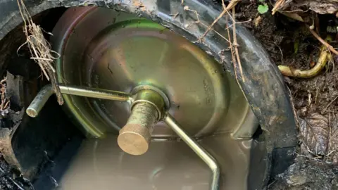 David Thornley A brass plug covers an outlet pipe