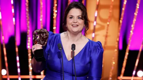 Getty Images Ruth Jones accepts the Female Performance in a Comedy Programme Award for 'Gavin & Stacey: The Finale' onstage during the 2025 BAFTA Television Awards with P&O Cruises Ceremony at The Royal Festival Hall on May 11, 2025 in London, England