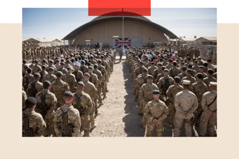 Getty Images Europe British troops and service personal remaining in Afghanistan gather for a Remembrance Sunday service
