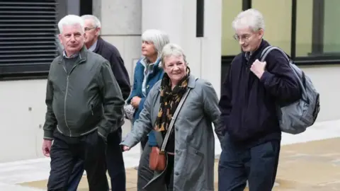 Eddie Mitchell Some of the family members of those who were killed in Shoreham Aircrash walking along street together