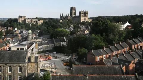 Getty Images A view of houses in Durham with Durham cathedral in the background.