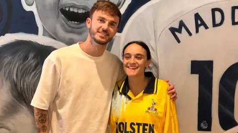 Emily pictured with Tottenham Hotspur footballer James Maddison