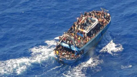 Greek Coast Guard An undated photo provided by the Greek coastguard shows migrants on board the crowded fishing vessel, 14 June 2023
