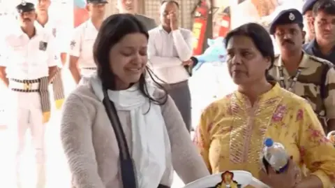PTI The photograph shows Himanshi Narwal crying as she bid farewell to her husband