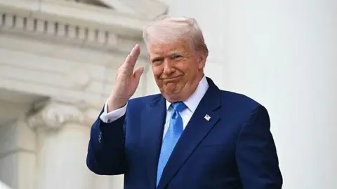 AFP/Getty US President Donald Trump arrives to deliver remarks at the National Memorial Day Observance at the Memorial Amphitheatre in Arlington National Cemetery in Arlington, Virginia, on May 26, 2025.