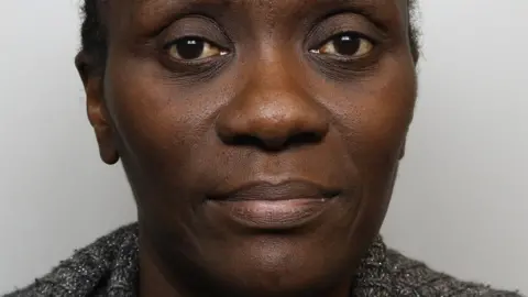 Thames Valley Police A police mugshot of Lydia Mugambe