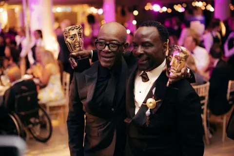 Getty Images  Lennie James and Ariyon Bakare pose in black tie with their TV Baftas