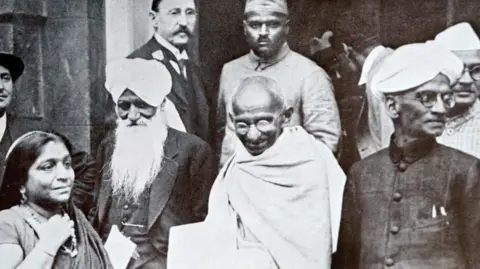 Universal Images Group via Getty Images Mahatma Gandhi on his way to a session of the Second Round Table Conference on India in 1931. 