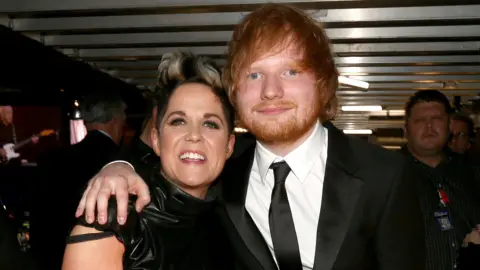 Getty Images Amy Wadge and Ed Sheeran backstage at the 2016 Grammy Awards