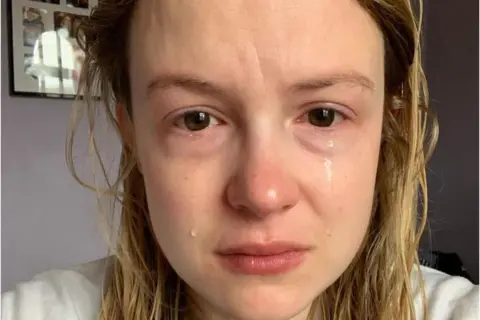 Kimberley Nixon Close up selfie of Kimberley crying with wet blonde hair.