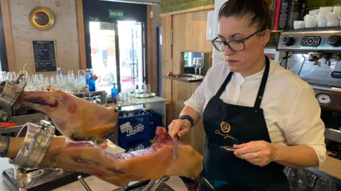 Guy Hedgecoe A leg of Spanish ham, or jamon, being carved at a bar in Seville