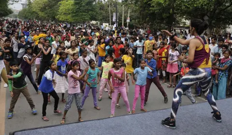 Getty Images A representative image of a group of children in colourful clothes performing Zumba dance in Gurgaon.