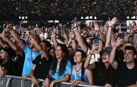 Getty Images Oasis fans at the Principality Stadium