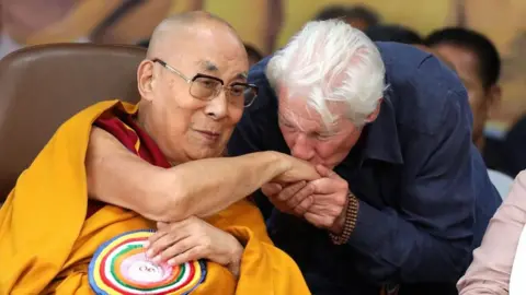 EPA/Shutterstock US actor Richard Gere kisses the hand of Tibetan Buddhism spiritual leader the Dalai Lama (L) during the spiritual leader's 90th birthday celebrations at Tibetans' main temple of Tsuglagkhang