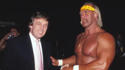 Getty Images Bare-chested Hulk shaking hands with a suited Donald Trump at Wrestlemania Vl in Atlantic City, New Jersey, in 1987