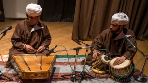 Getty Images Traditional sufi musicians of Kashmir, play santoor and other musical instruments on the stage, on March 23, 2019 in Srinagar, the summer capital of Indian administered Kashmir, India. 