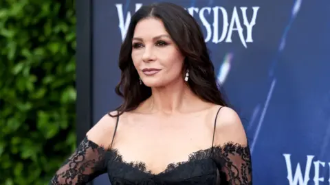 Getty Images Catherine Zeta-Jones attends Netflix's "Wednesday" ATAS Official Photo Call at Hollywood Forever on April 29, 2023 in Hollywood, California