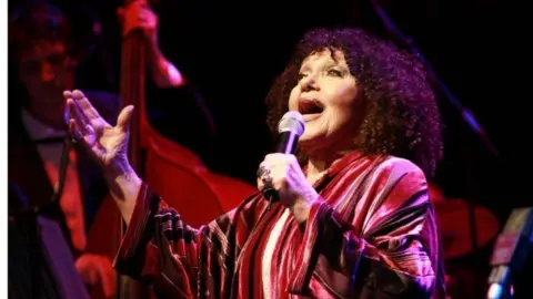 BBC Cleo Laine singing during her heyday, on stage in a flowing dress