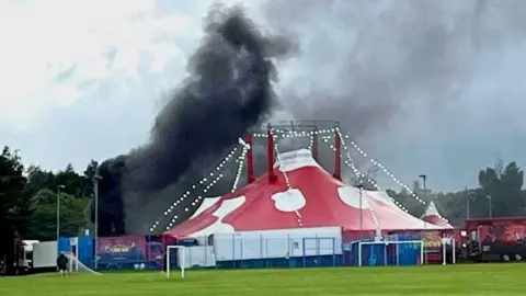 Fife Jammer Locations Black smokes can be seen coming from behind a big top circus tent