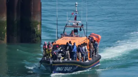 PA group of people thought to be migrants are brought in to Dover, Kent, onboard an RNLI Lifeboat