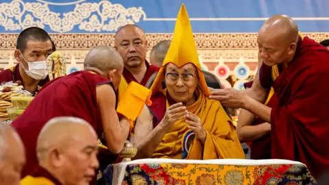 AFP Tibetan spiritual leader the Dalai Lama (C) attends a Long Life Prayer offering ceremony at the Main Tibetan Temple in McLeod Ganj, near Dharamsala on June 30, 2025.