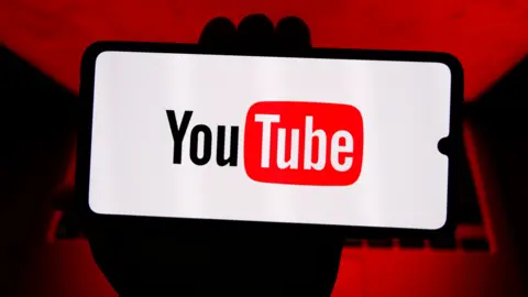 Getty Images The YouTube logo, as seen on a smartphone
